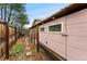 View of a charming backyard chicken coop featuring a secure enclosure, natural light, and easy access at 7333 S Dexter Way, Centennial, CO 80122
