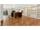 Spacious, open-concept kitchen and dining area featuring hardwood floors and access to a deck at 7333 S Dexter Way, Centennial, CO 80122