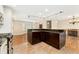 Spacious eat-in kitchen featuring an island and views of the dining and living areas at 7333 S Dexter Way, Centennial, CO 80122