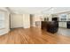 Open concept living area with hardwood floors, a stone fireplace, and dining area at 7333 S Dexter Way, Centennial, CO 80122