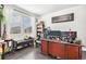 Home office featuring a dark wood desk, ample natural light and decorative touches at 25064 E Archer Pl, Aurora, CO 80018