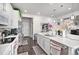 Beautiful kitchen with a large white island, stainless steel appliances and dark wood flooring at 25064 E Archer Pl, Aurora, CO 80018