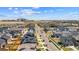 This aerial view showcases a residential neighborhood with well-maintained homes and scenic surroundings at 19131 E 65Th Ave, Denver, CO 80249