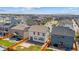 Aerial view showcasing the backyard, patio, and modern homes in a well-planned residential neighborhood at 19131 E 65Th Ave, Denver, CO 80249