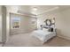 The main bedroom features carpeted floors, tray ceiling, and a double window providing lots of natural light at 19131 E 65Th Ave, Denver, CO 80249
