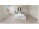 Well-lit bedroom featuring a comfortable bed, neutral color scheme, and contemporary artwork at 19131 E 65Th Ave, Denver, CO 80249