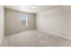 Neutral bedroom with carpet, a window, and an electrical outlet at 19131 E 65Th Ave, Denver, CO 80249