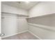 Walk-in closet complete with carpeted floors and metal racks ready to be organized at 19131 E 65Th Ave, Denver, CO 80249