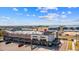 An aerial view of an outdoor shopping area with Pizza Hut, Men's Wearhouse and other businesses at 19131 E 65Th Ave, Denver, CO 80249