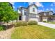 Attractive two-story home featuring a well-maintained lawn and a convenient two-car garage at 19131 E 65Th Ave, Denver, CO 80249