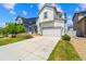 Beautiful two-story home with modern architecture, a well-kept lawn, and a two-car garage at 19131 E 65Th Ave, Denver, CO 80249