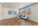 Bright living room features hardwood floors, recessed lighting, and a large window for plenty of natural light at 19131 E 65Th Ave, Denver, CO 80249