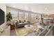Bright and airy living room featuring modern furniture, large windows, and an open floor plan at 19131 E 65Th Ave, Denver, CO 80249