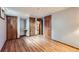 Spacious basement with vinyl flooring, built-in desk, and several closet doors for ample storage at 5480 S Holly St, Greenwood Village, CO 80111
