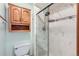 Nicely updated bathroom with decorative tile shower, modern vanity and fixtures at 5480 S Holly St, Greenwood Village, CO 80111