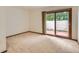 Bright bedroom with a large sliding glass door offering outdoor views at 5480 S Holly St, Greenwood Village, CO 80111