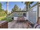Inviting outdoor deck with bench seating and access to a well-maintained yard at 5480 S Holly St, Greenwood Village, CO 80111