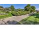 Picturesque front yard with manicured landscaping, including mature trees and green bushes at 5480 S Holly St, Greenwood Village, CO 80111