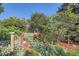 Scenic garden with red flowers and lush green foliage, providing a tranquil outdoor space at 5480 S Holly St, Greenwood Village, CO 80111