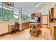 Well-lit kitchen boasts an island, skylights, ample counter space, and wood floors at 5480 S Holly St, Greenwood Village, CO 80111