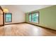 Living room with hardwood floors, bay window, and natural light at 5480 S Holly St, Greenwood Village, CO 80111