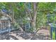 Unique treehouse deck with built-in trees and latticework, offering a nature-filled retreat at 5480 S Holly St, Greenwood Village, CO 80111