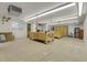 Unfinished basement with concrete floors and large workshop area with workbench and tool storage at 1019 24Th St, Golden, CO 80401