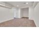 Finished basement area featuring neutral paint, carpet, recessed lighting, and an open closet space at 1019 24Th St, Golden, CO 80401