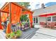 Outdoor deck with comfortable seating and a pergola draped with orange fabric at 1019 24Th St, Golden, CO 80401