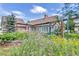 Charming home featuring a colorful wildflower garden in the front yard at 1019 24Th St, Golden, CO 80401