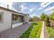 Beautiful backyard with a well-maintained lawn, patio, and landscaping at 4580 S Ukraine Cir, Aurora, CO 80015