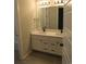 Bathroom with double sink vanity and modern fixtures at 4580 S Ukraine Cir, Aurora, CO 80015