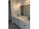 Bathroom with double sinks and a large mirror at 4580 S Ukraine Cir, Aurora, CO 80015