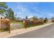 Backyard with a gravel area surrounded by a wooden fence and gate, providing privacy at 3402 S Olathe Way, Aurora, CO 80013