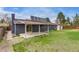 Spacious backyard with well-maintained lawn, a covered patio, and partial gravel landscaping at 3402 S Olathe Way, Aurora, CO 80013