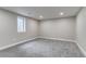 Finished bedroom with gray walls and carpet, recessed lights, and a bright window at 3402 S Olathe Way, Aurora, CO 80013