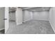Finished bedroom with light gray walls and carpet, and white trim throughout at 3402 S Olathe Way, Aurora, CO 80013
