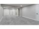 Finished bedroom with light gray walls and carpet, featuring white trim and multiple doorways at 3402 S Olathe Way, Aurora, CO 80013