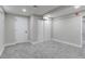Finished bedroom with light gray walls and carpet, featuring white trim and doors at 3402 S Olathe Way, Aurora, CO 80013