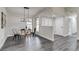 Dining area boasts ample natural light, modern lighting, and an open layout for easy entertaining at 3402 S Olathe Way, Aurora, CO 80013