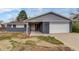 Attractive single-story home featuring a two-car garage, covered entryway, and a low maintenance front yard at 3402 S Olathe Way, Aurora, CO 80013