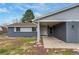 Charming single-story home with a covered entrance, brick accents, and well-kept front yard at 3402 S Olathe Way, Aurora, CO 80013