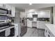 Spacious kitchen offers stainless steel appliances and modern finishes at 3402 S Olathe Way, Aurora, CO 80013