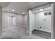 Finished laundry room with washer/dryer hookups, light gray walls, and gray vinyl flooring at 3402 S Olathe Way, Aurora, CO 80013