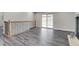 Living room features vinyl plank flooring and sliding glass doors to backyard at 3402 S Olathe Way, Aurora, CO 80013