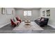 Comfortable living room with a cozy atmosphere, plush seating, stylish rug, and plenty of space at 3402 S Olathe Way, Aurora, CO 80013