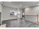 Open floorplan with vinyl plank flooring, fireplace, and updated kitchen view at 3402 S Olathe Way, Aurora, CO 80013