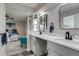 Luxurious main bathroom featuring dual sinks, and a serene design at 3402 S Olathe Way, Aurora, CO 80013