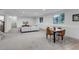 Finished basement with a seating area, a dining table, and plenty of light at 6379 Spotted Fawn Run, Littleton, CO 80125