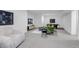 Spacious basement area with comfortable seating, modern décor, and recreational space at 6379 Spotted Fawn Run, Littleton, CO 80125